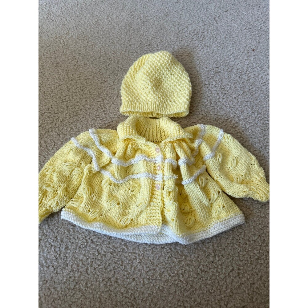Handmade baby sweater and blankets